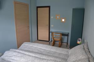 Postel nebo postele na pokoji v ubytování Impronte Nel Bosco