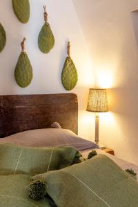 Postel nebo postele na pokoji v ubytování Alesia luxury suite Ostuni