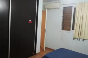 a room with a black door and a window at Habitaciones confortables con baño privado in San Rafael