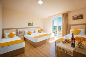 Postel nebo postele na pokoji v ubytování Iveria Elli Hotel