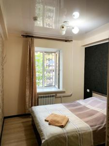 Ένα ή περισσότερα κρεβάτια σε δωμάτιο στο Гостиница GOBI