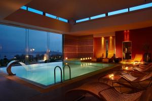 a large swimming pool in a hotel with a view at Limneon Resort & Spa in Kastoria