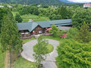 an aerial view of a large house with a yard at Reposer Hakuba in Hakuba