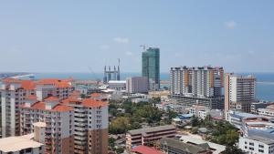 a city skyline with tall buildings and the ocean at TINGKAT 21/10, PANGSAPURI LADANG TOK PELAM in Kuala Terengganu
