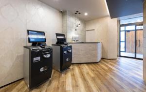 an office with a cash counter and a cash register at Hotel Classe Stay Sapporo in Sapporo
