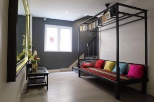 Postel nebo postele na pokoji v ubytování Four Sisters Homestay