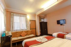 Postel nebo postele na pokoji v ubytování Hotel Nepalaya
