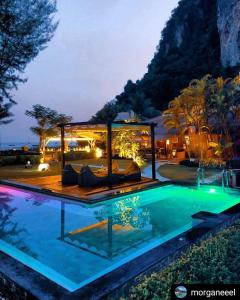 a resort with a pool and a villa at Mama Beach Residence - Adults Only in Phi Phi Don