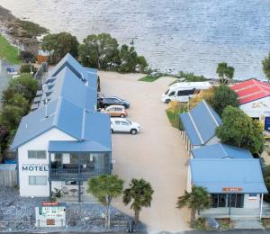 an aerial view of a house with a flooded street at Collingwood Park Motel in Collingwood