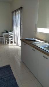 Kuchyň nebo kuchyňský kout v ubytování Joy Apartments Zakynthos