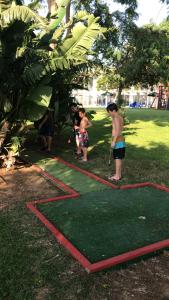 a group of people playing a game of frisbee golf at Suite Caesar - Neot Golf in Caesarea