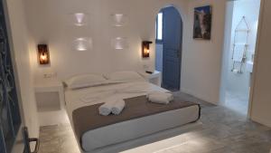 Posteľ alebo postele v izbe v ubytovaní Grey Rooms Naxos