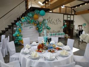 a table set up for a birthday party with balloons at Celinburg Guest House in Kaliningrad