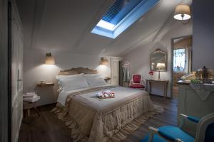 Postel nebo postele na pokoji v ubytování Roncaglia Suite