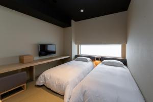 Giường trong phòng chung tại ONSEN RYOKAN YUEN SHINJUKU +55 ảnh