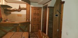 a kitchen with a counter and a sink in a room at Садиба Зґарда in Yaremche