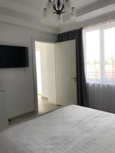 Postel nebo postele na pokoji v ubytování Guest House “Aura”
