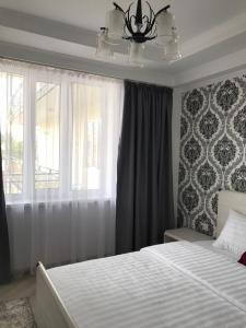Postel nebo postele na pokoji v ubytování Guest House “Aura”