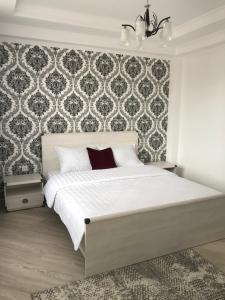 Postel nebo postele na pokoji v ubytování Guest House “Aura”