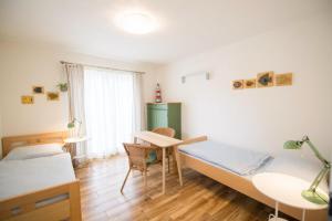 Posteľ alebo postele v izbe v ubytovaní Apartmány Lea