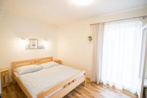 Posteľ alebo postele v izbe v ubytovaní Apartmány Lea