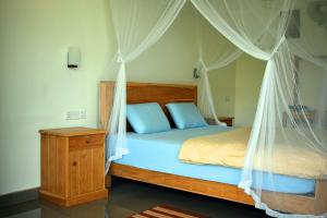 Postel nebo postele na pokoji v ubytování Raveena Guest House
