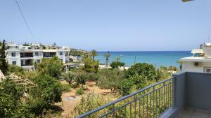 a view of the beach from the balcony of a house at Ellie Apartments Stalida in Stalís