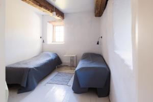 Postel nebo postele na pokoji v ubytování Liste Gård