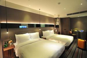 Tempat tidur dalam kamar di WESTGATE Hotel