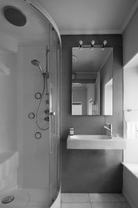 a bathroom with a shower and a sink at Hydras Chromata in Hydra