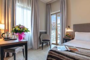 Postel nebo postele na pokoji v ubytování Fragrance Hotel St. Peter