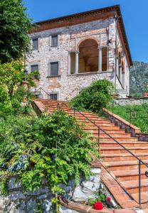 a building with stairs in front of it at Hotel Villa Rinascimento in Lucca