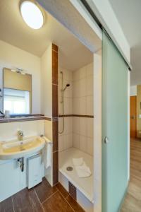 Koupelna v ubytování Hotel l'adresse garni