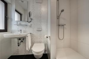 Koupelna v ubytování Hotel l'adresse garni
