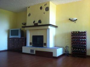 TV a/nebo společenská místnost v ubytování B&B Soiano Del Lago