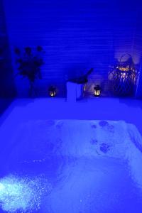 a room with a tub filled with snow and lights at Nephele Luxury Suite in Thessaloniki