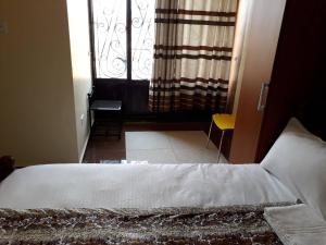 Postel nebo postele na pokoji v ubytování Egret Pilgrims Inn