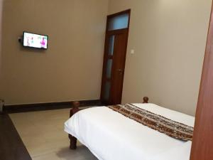 TV a/nebo společenská místnost v ubytování Egret Pilgrims Inn