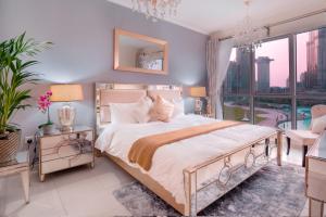 a bedroom with a large bed and a large window at Elite Royal Apartment - Full Burj Khalifa & Fountain View - 2 bedrooms and 1 open bedroom without partition in Dubai