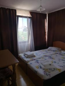 Postel nebo postele na pokoji v ubytování Felix Residence Costinesti