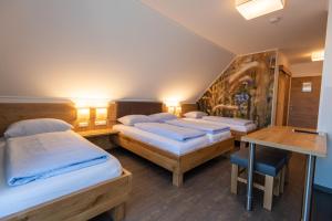 Кровать или кровати в номере Genussgasthof Willenshofer