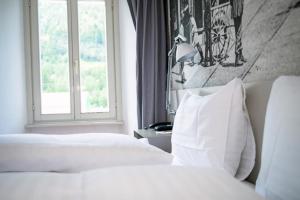 Rúm í herbergi á Hotel & Restaurant Forni