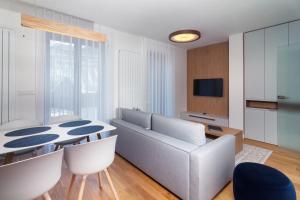 TV a/nebo společenská místnost v ubytování Apartments Residence Grand