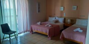 Postel nebo postele na pokoji v ubytování Posidonio Hotel