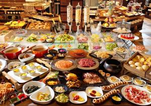 a buffet with many different types of food on a table at HOTEL＆SPA CENTURY MARINA HAKODATE in Hakodate