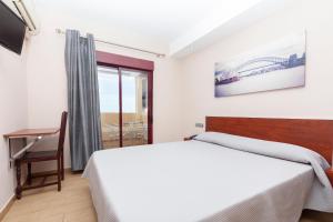 Posteľ alebo postele v izbe v ubytovaní Hotel Olympia Ronda I