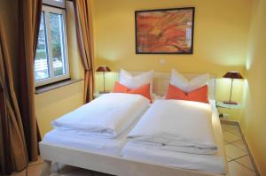 Кровать или кровати в номере Appartements-Seehues-Wohnung-Seestern