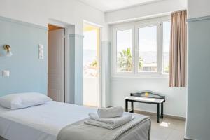 Postel nebo postele na pokoji v ubytování Phaedra Hotel