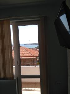 a door leading to a balcony with a view at Guest House Pepina in Sozopol