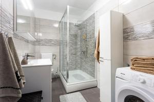 Kúpeľňa v ubytovaní APARTMANI KAROCA 2